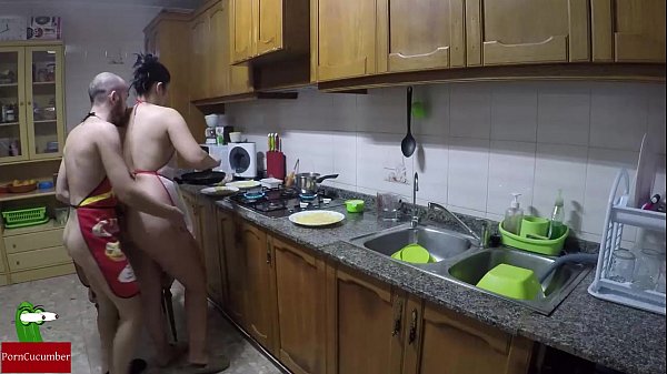 Nude women cooking