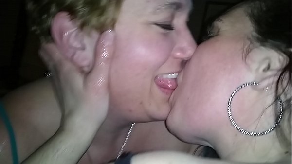Wife kissing friend