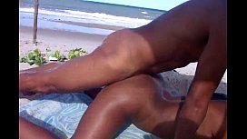 Naked black women on the beach releasing the ass